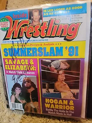 Macho Man And Elizabeth Signed Wrestling Magazine. • $825