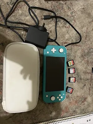 Bundle - Nintendo Switch Lite (Turquoise) And Four Games! • $400