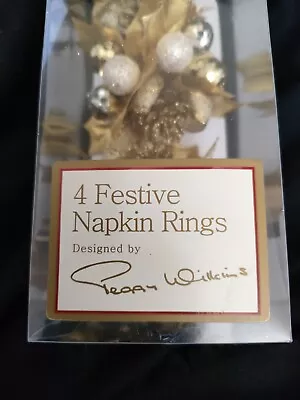 Set Of Four Peggy Wilkins Festive Gold Holly And Baubles Napkin Rings  • £10