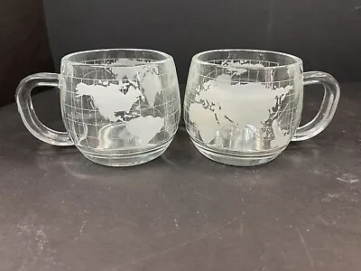 Pair (2) Nescafe World Globe Etched Glass Mugs  THE NESTLE CO. INC.  Variation • $9.96