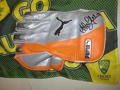 $399 • Buy Adam Gilchrist (Australia) Signed Puma Wicketkeeping Glove (Orange/Silver) + COA