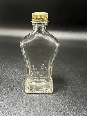 Vintage L.B LAB.INC Hollywood Embossed Glass Medicine Bottle  Metal Lid 1.25oz • $6