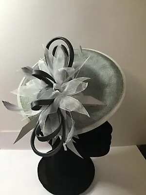 Grey Fascinator With Sinamay Loops & Feathers On A Base Set On A Headband • £10