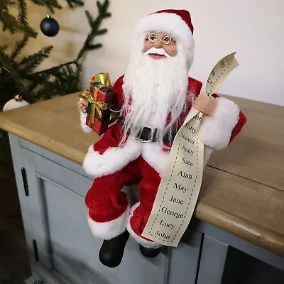 30cm Sitting Santa Father Christmas Decoration Holding Gifts & Name List In Red • £11.75