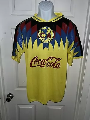 Vintage Coca-Cola Soccer Jersey T-shirt Yellow Blue Red Measurements           Q • $14.95