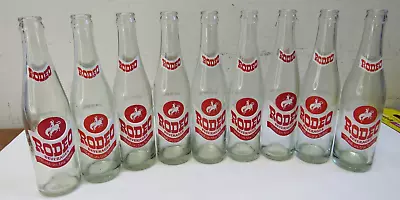 Lot Of 9 Vintage Rodeo Beverages Best In The West Soda Glass Bottle 10 FL . Oz • $99