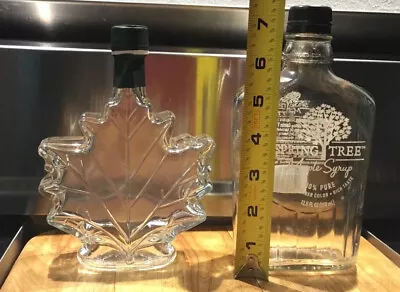 2 CLEAR GLASS SYRUP JARS BOTTLES EMPTY 1 MAPLE LEAF 1 SPRING TREE Both W/ Lids • $12.95
