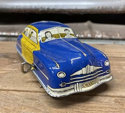 Vintage 1950's Wind Up Tin Family Woody Sedan Courtland Walt Reach Car Toy • $125