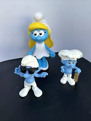 (2) 2013 Peyo McDonald's Smooth & Baker Smurf Action Figures 3  And A Smurfette • $8