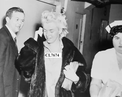 Marilyn Monroe Wearing A Fur Coat Hides Her Face While Leaving A Hospital Photo • $10.99