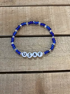 Handmade Elastic Blue/Clear Glass Bead Air Force Bracelet • $5