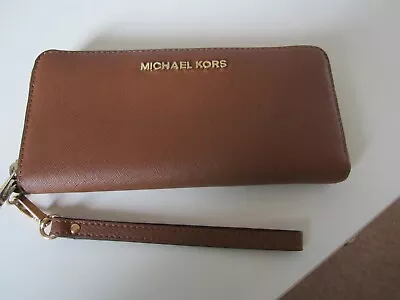 Michael Kors  Tan Purse With Wrist Strap • £24.95