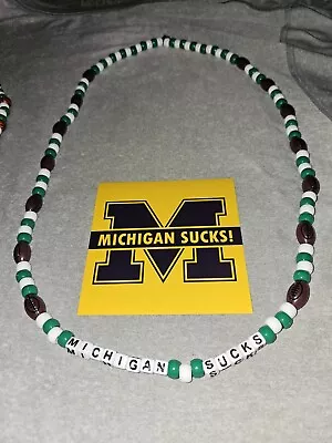 Michigan State Spartans MICHIGAN SUCKS Football Bead Necklace & Sticker • $11