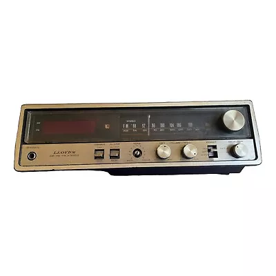 Vintage LLoyd's Am Fm Stereo Radio Alarm Clock Simulated Wood Grain Model J257B • $18.99