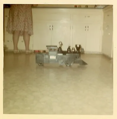 Vintage Photo Green Toy Train Kitchen Floor Unknown Mystery Woman Legs In Frame • $8.79
