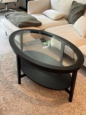 Set Of 2 IKEA Black-Brown Tables: Oval Coffee Table And Round Side Coffee Table • $150