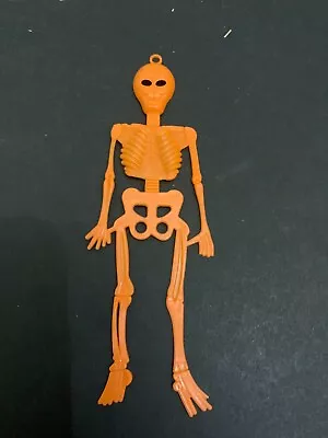 Vintage Halloween Plastic Orange Skeleton Decoration • $10