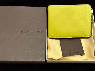 Authentic Louis Vuitton Damier Infini Multiple Wallet Neon Yellow  • $289