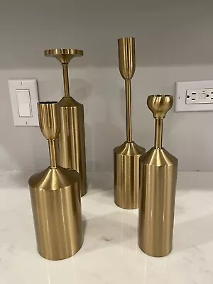 4 Gold Metal Candlesticks Of Varying Heights. Mid Century Modern. Sleek. • $60