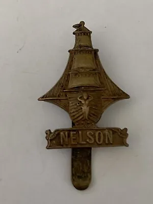BRASS NELSON BATTALION RND CAP BADGE - “O” In Nelson Is Straight • £65