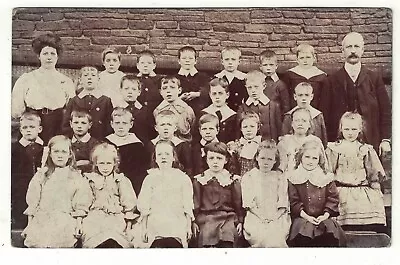 Real Photo Postcard Of A Group Of Edwardian School Children And Their Teachers • £2.75