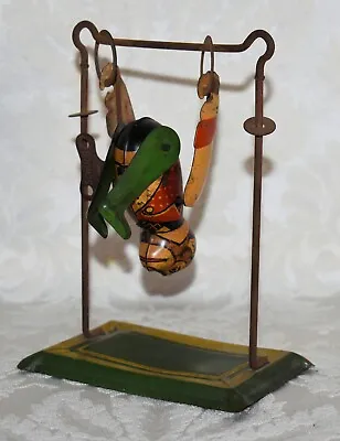 A8. ANTIQUE TIN TOY MONKEY DOING GYMNASTICS Ca1920'S PARTIALLY WORKS • $79