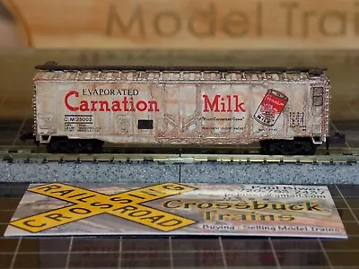 N-scale 50' Plug Door Boxcar Carnation Milk CM 25003 Weathered (020133) • $9.89