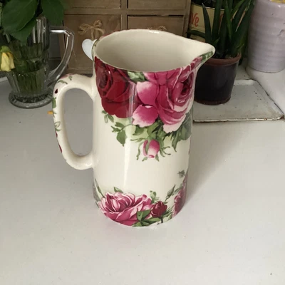 £5 • Buy Heron Cross Pottery Jug  Floral Design