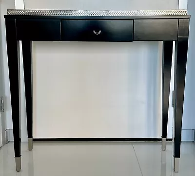 Black Behind The Sofa Table With Mirrored Top And Silver Colored Trim And Feet • $60