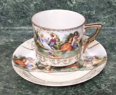 Vintage LEFTON 3 Footed Tea Cup And Saucer Courting Couples Gold Accents  • $14.99