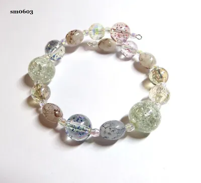 A MEMORY WIRE BRACELET WITH ACRYLIC BEADS IN DIFFERENT SIZES & TYPES......sm0603 • £4