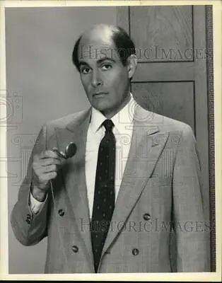 1987 Press Photo Actor Alan Rachins Checks Pocket Watch In TV Show LA Law Still • $19.99