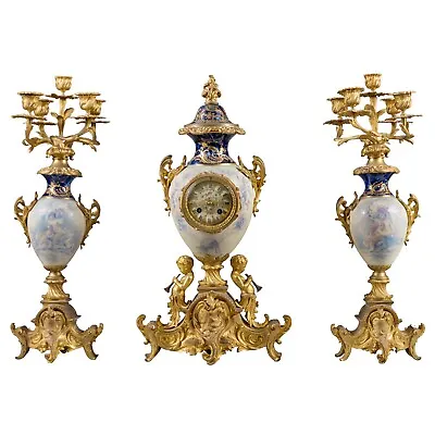 A French Antique Sevres Style White Porcelain & Gilt Bronze Clock Garniture • $23000