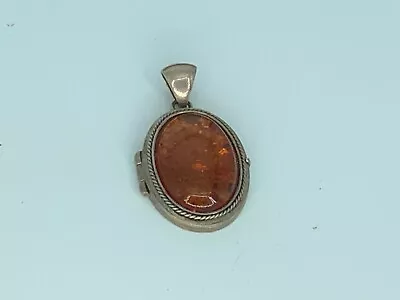 Vintage Sterling Silver And Amber Locket. • $49.99