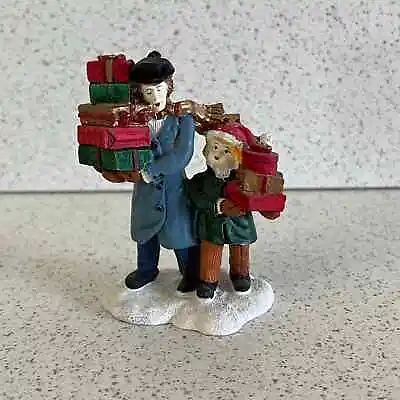 Mervyns Village Square Man Boy Carrying Presents 1991 Figurine Holiday Christmas • $20