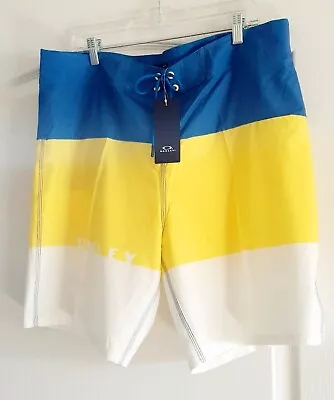 OAKLEY 36 Board Shorts Yellow Blue White Zip Pocket Logo Stretch NEW! • $19.99