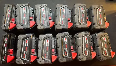 12 Used Milwaukee M18 Red Lithium Battery Packs  • $98