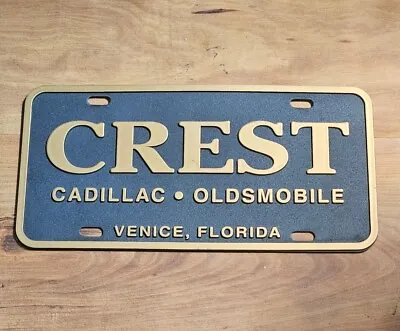 Vintage Excellent Condition AUTO Booster License Plate Crest CADILLAC OLDSMOBILE • $34.95