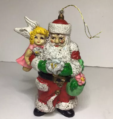 Santa Claus Blow Mold Ornament Holding Flowers Angel On Arm Plastic 5 5/8 Inch  • $14.99