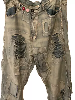 Quintessential Magnolia Pearl Distressed And Patched Jeans • $425