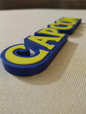 Capcom Video Game Logo Sign 8.25in (3D Printed Man Cave Game Room Videogame  • $15