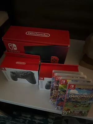 BUNDLE - Full Nintendo Switch V2 (HAC-001-01) / 4 Games / 2 Pro Controllers  • $330