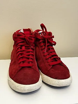 Red Nike High Tops • $65
