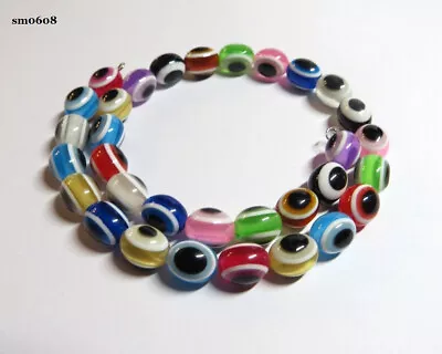 A MEMORY WIRE BRACELET WITH OVAL ACRYLIC  EYE  BEADS ......sm0608 • £4.50