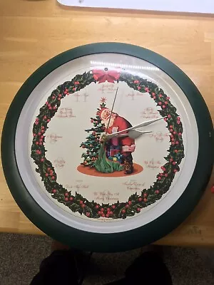 Mark Feldstein Christmas Wall Clock 1999 Musical Carols Santa Wreath 13” • $29.95