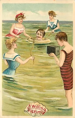 Postcard Willing Victim Man In Life Ring Surrounded By Bathing Women WIth Camera • $17.54