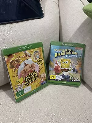 Lot Of 2 Sealed Xbox One Games Super Monkey Ball Banana Blitz & SpongeBob  • $60
