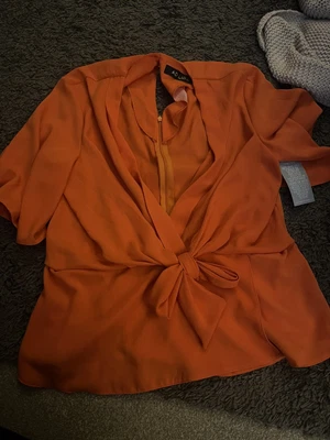 £12 • Buy Orange Tie Front Top
