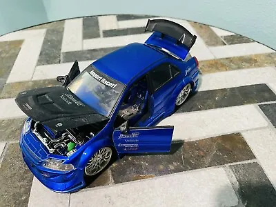 Jada Import Car  1:24 Blue Mitsubishi Lancer Evolution VI Collectible Model Car • $59.02