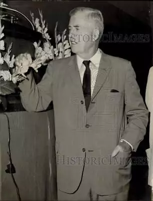 1957 Press Photo Henry Wallace Inspects Flower At An Event In Miami Florida • $19.99